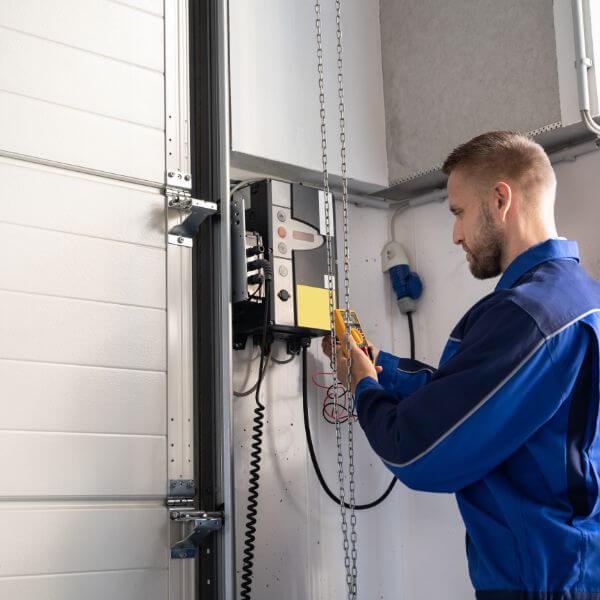 Garage Door Repair Guys carrying out a garage door opener replacement with full testing to ensure smooth and safe door operation.